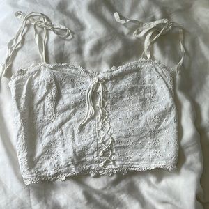 Kendall & Kylie white tank with flower detailing (size XS)